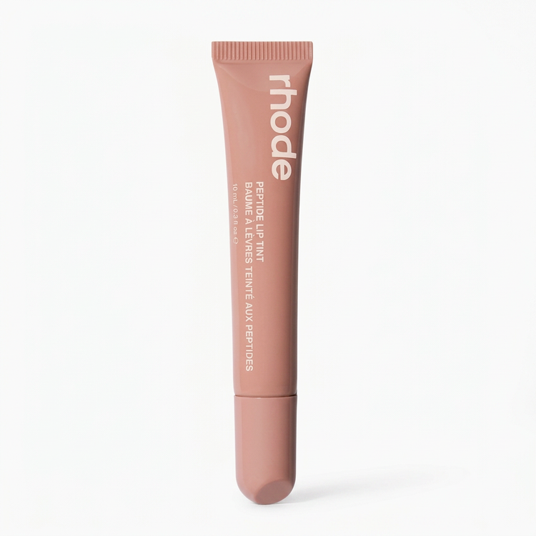Rhodes Peptide Lip Tint in Toast peachy nude tube on white background